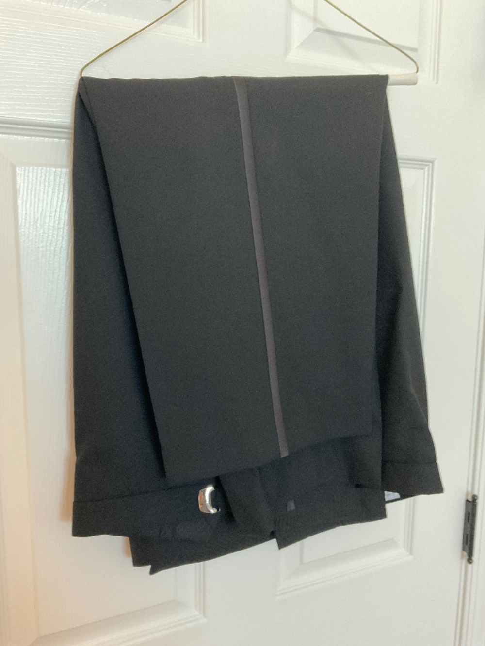 Men’s black tuxedo pants.  Adjustable waist, 49/50.  27” length Worn once! Wool